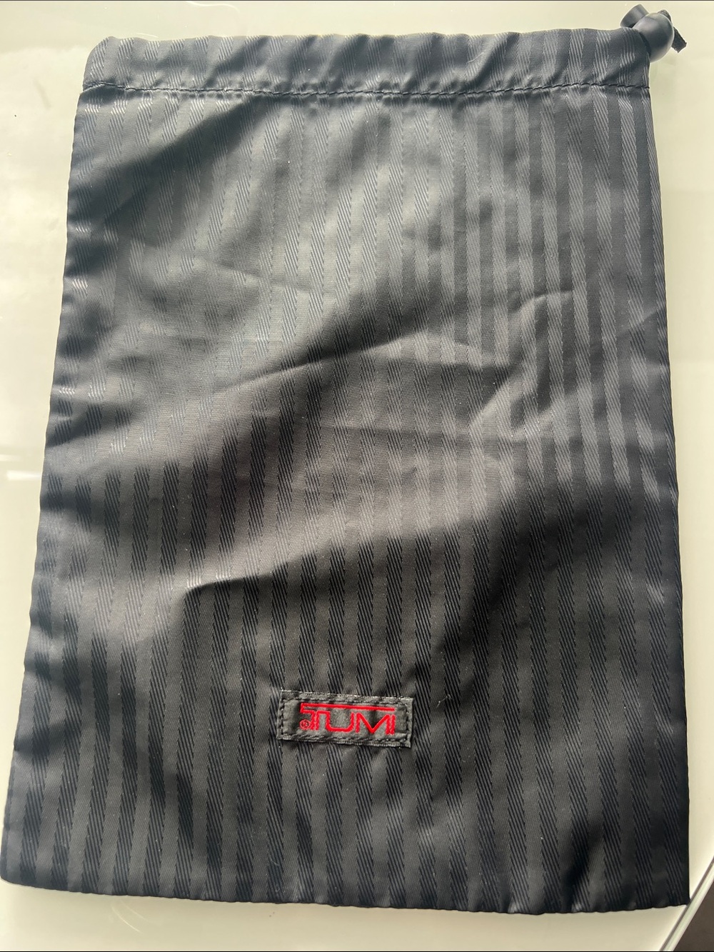 Tumi Black Drawstring Pouch with Red Logo